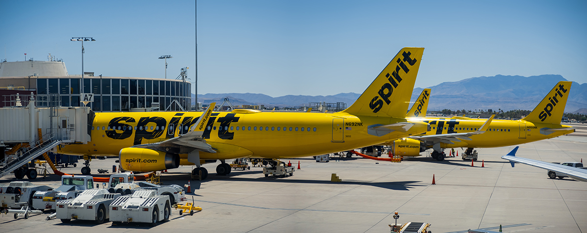 Spirit Airlines aircraft at airport gates prior to the airline's 2026 bankruptcy liquidation